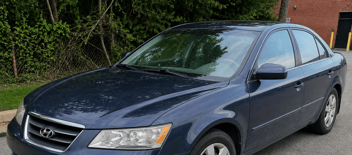 After auto detailing: the same blue sedan restored and clean